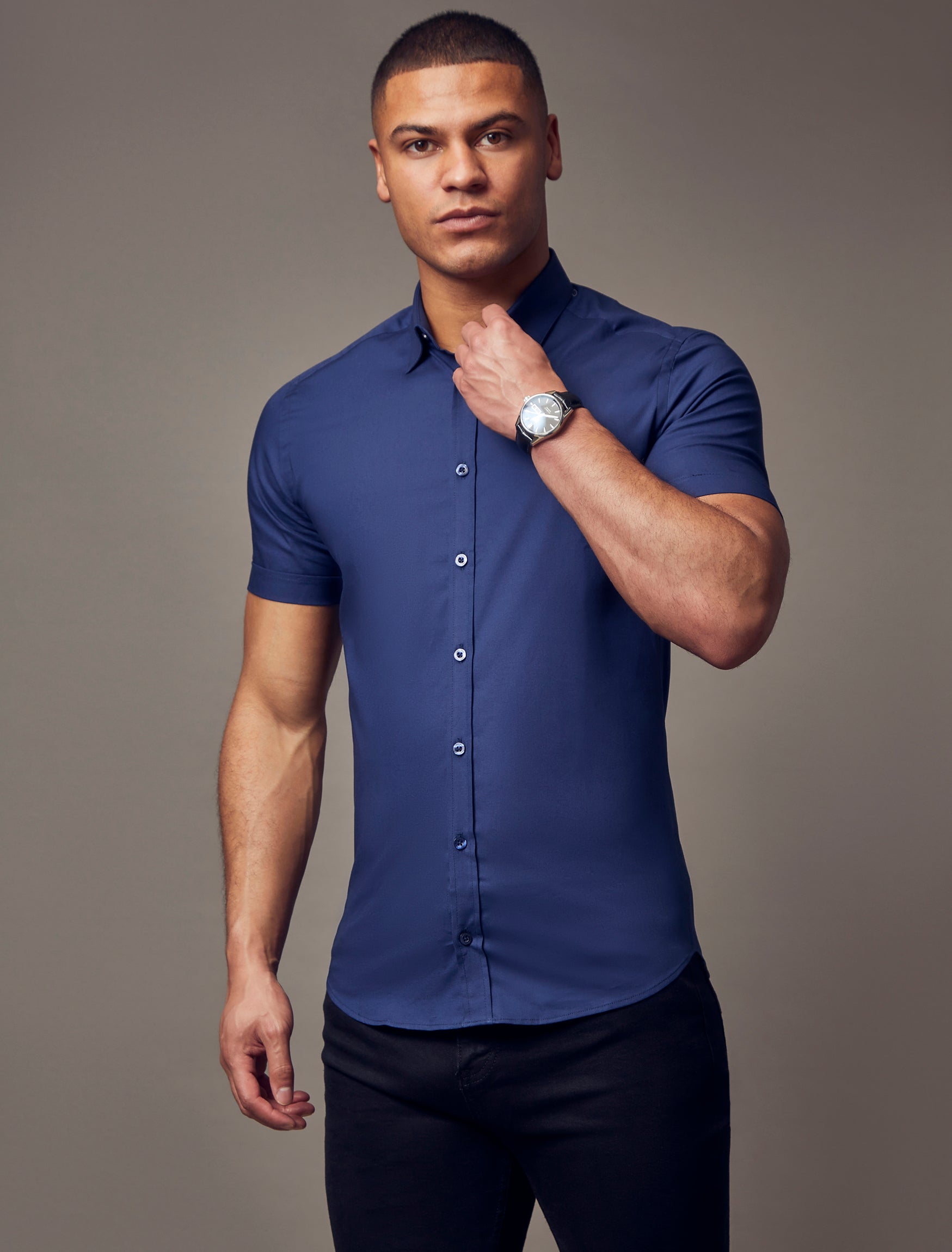 navy short sleeve tapered fit shirt, emphasizing the muscle fit features for a flattering and well-sculpted look by Vittorini Menswear